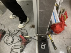 What is the principle behind leak-proofing in bathrooms without breaking tiles?