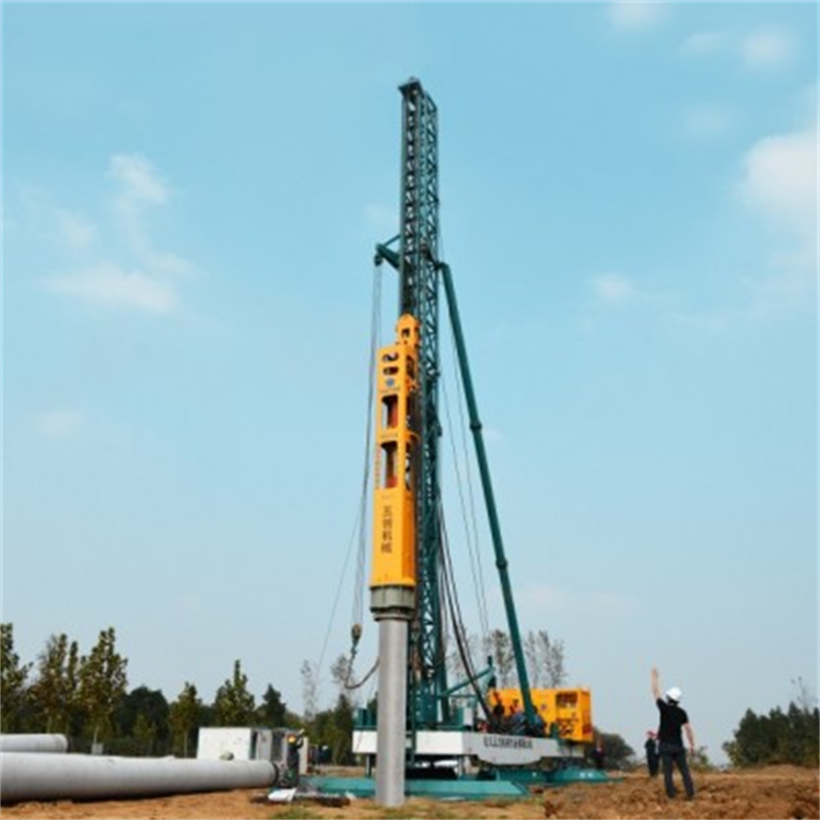 Pile driving with hammer
